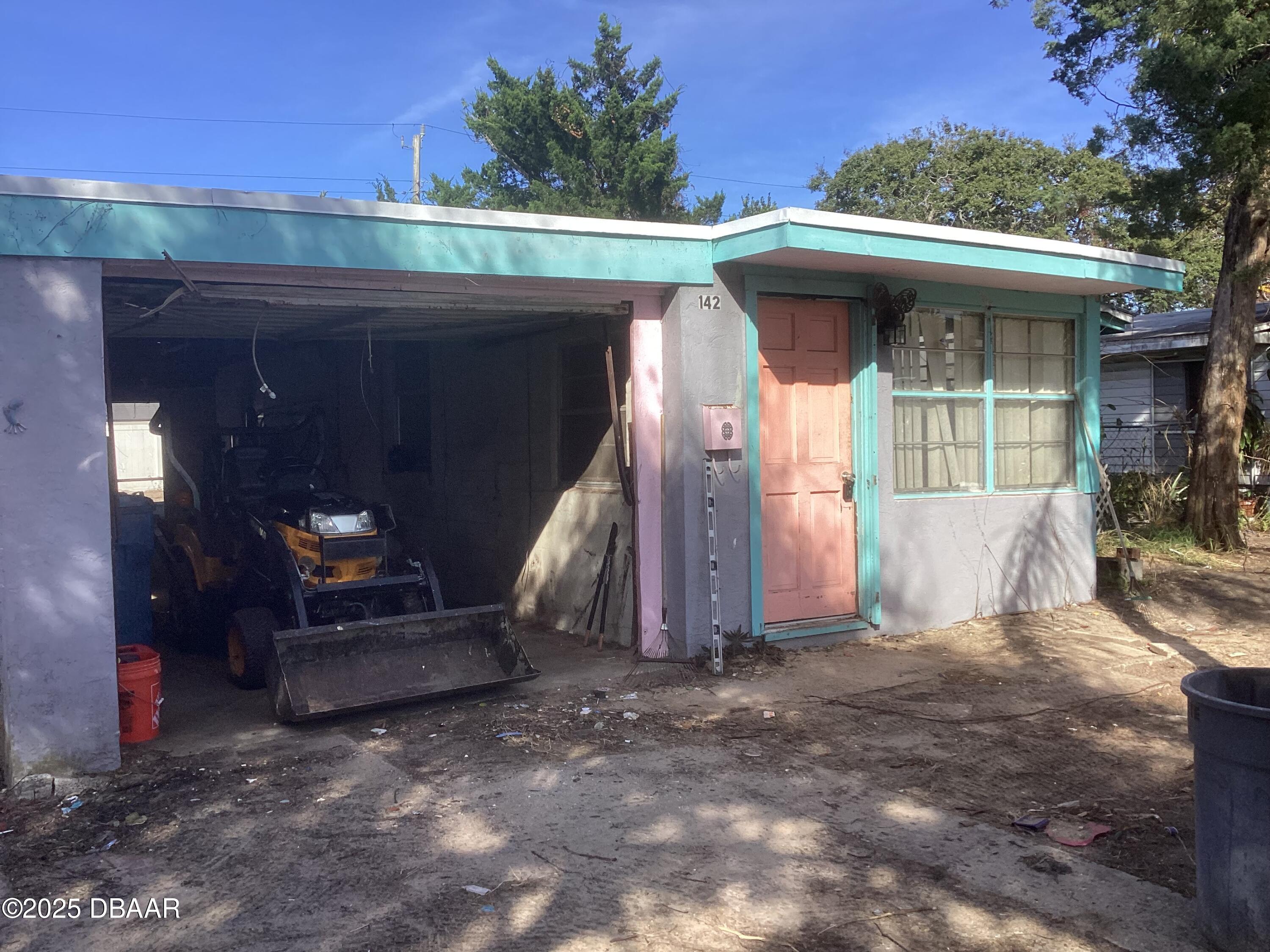142 Holland Road Ormond Beach, FL 32176 - Photo 2 of 15 a front view of a house