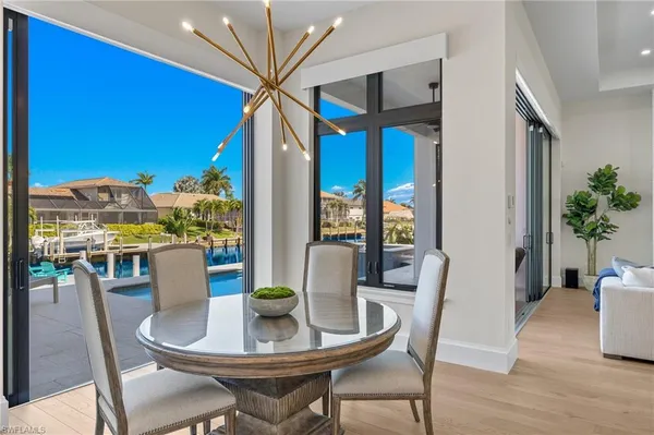 a kitchen with stainless steel appliances granite countertop a sink stove and wooden floor