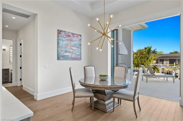 a kitchen with stainless steel appliances granite countertop a sink refrigerator and cabinets