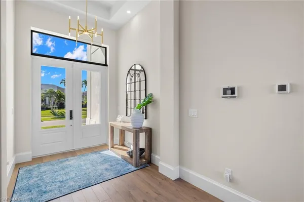 wooden floor in a hall with an entryway
