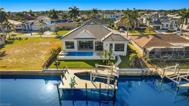 a view of a lake with a table and chairs