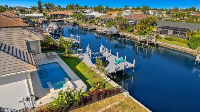a view of a swimming pool with outdoor seating