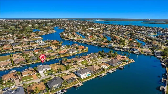 an aerial view of a house with a ocean view
