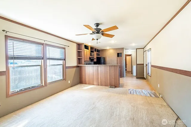 a view of a kitchen with a sink and a window