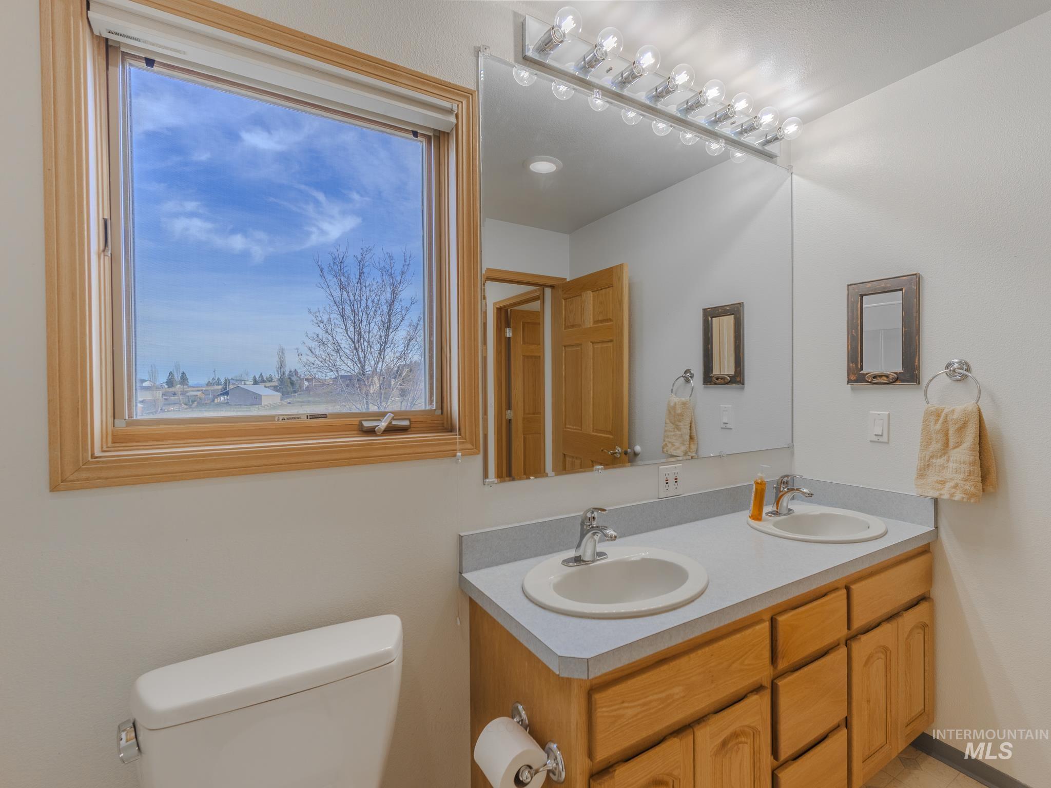 202 Fish Hatchery Road Grangeville, ID 83530 - Photo 24 of 50 Bathroom featuring double vanity and toilet