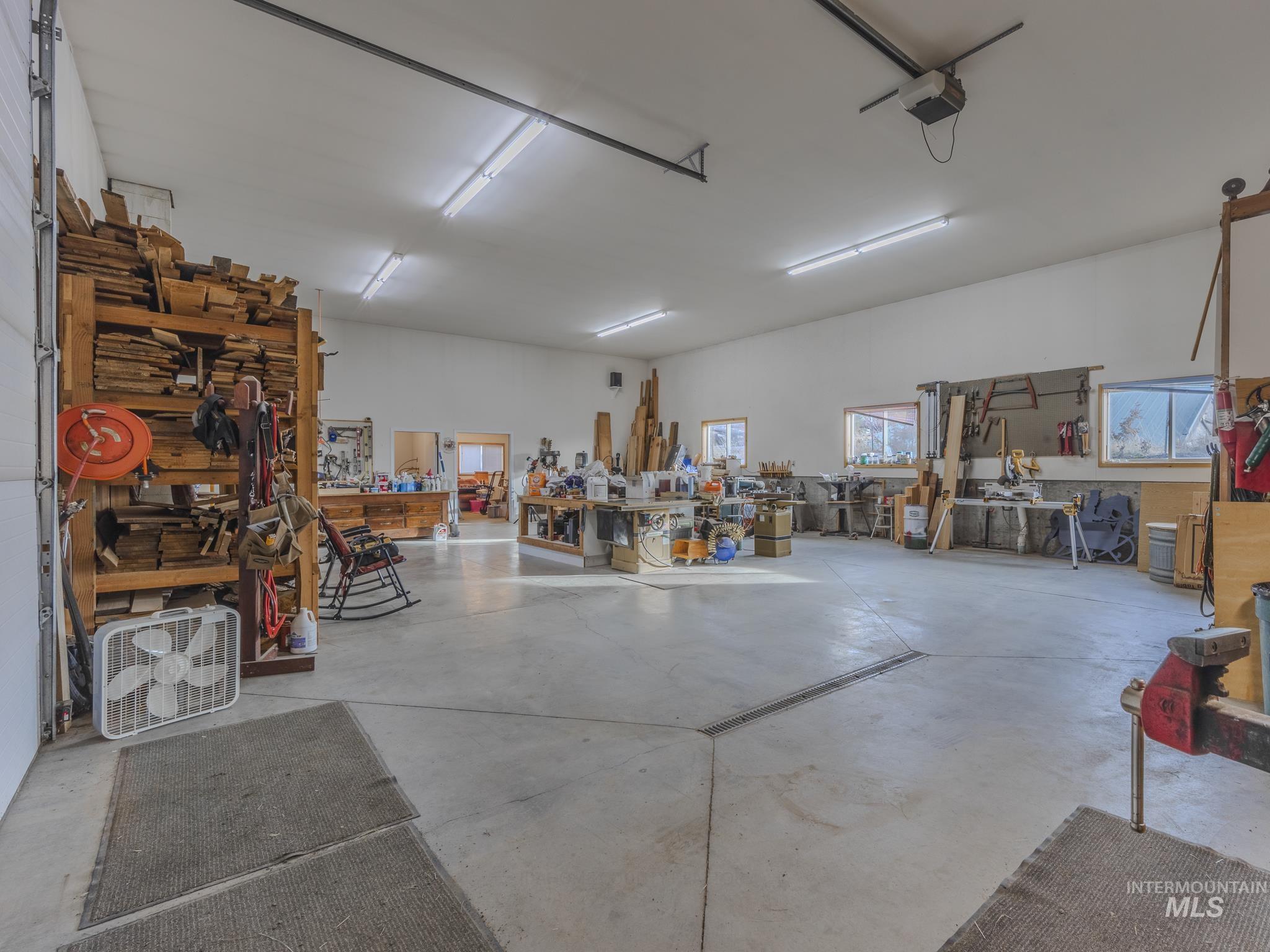 202 Fish Hatchery Road Grangeville, ID 83530 - Photo 41 of 50 Shop featuring a workshop area and a garage door opener
