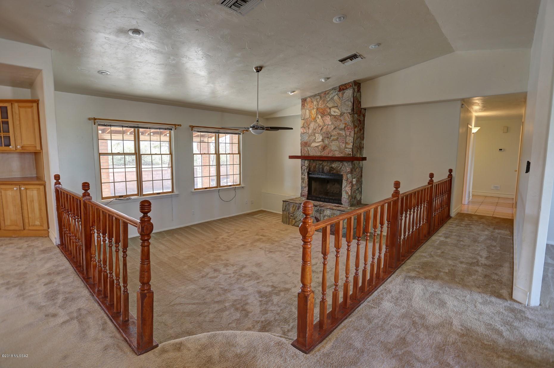 5851 South Avra Road Tucson, AZ 85735 - Photo 25 of 46 a view of livingroom with furniture and fireplace