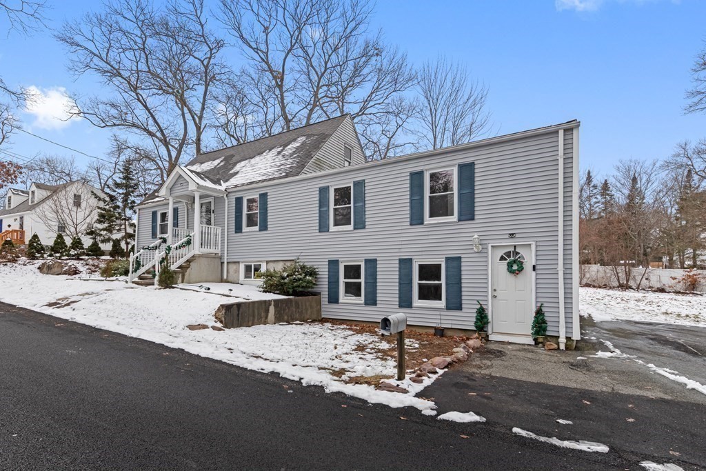 76 Rockefeller Street Randolph, MA 02368 - Photo 2 of 40 a front view of a house with a yard