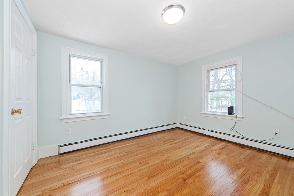 76 Rockefeller Street Randolph, MA 02368 - Photo 25 of 40 wooden floor in an empty room with a window
