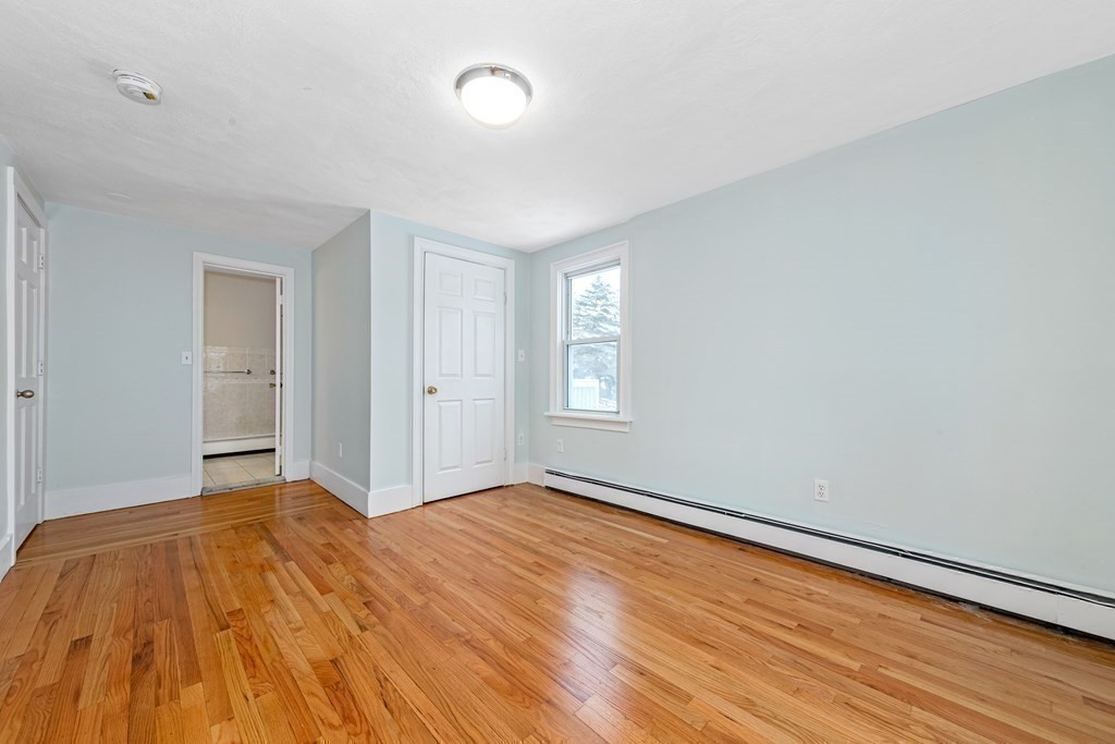 76 Rockefeller Street Randolph, MA 02368 - Photo 27 of 40 a view of empty room with wooden floor