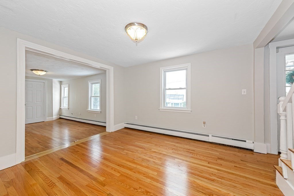 76 Rockefeller Street Randolph, MA 02368 - Photo 30 of 40 a view of empty room with wooden floor and fan