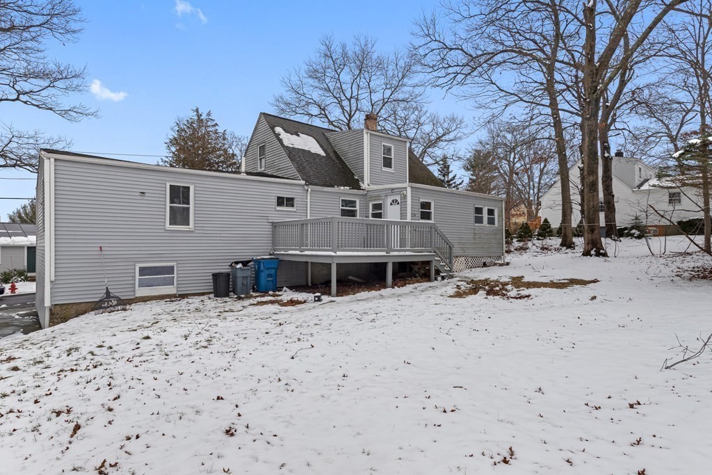 76 Rockefeller Street Randolph, MA 02368 - Photo 3 of 40 a tall house with a large tree in front of it