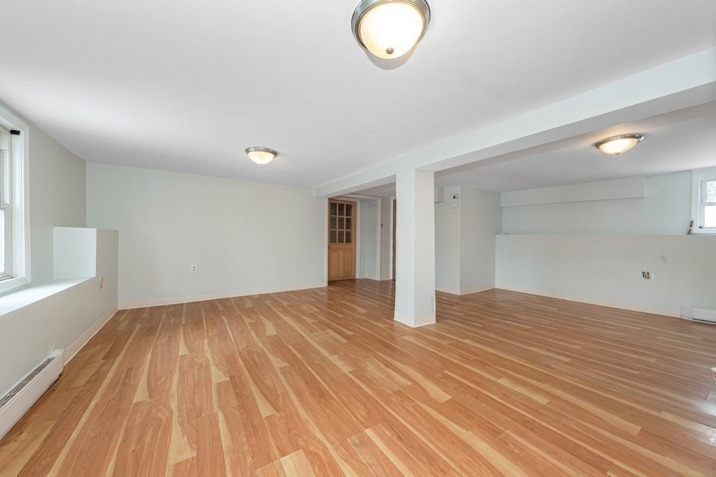 76 Rockefeller Street Randolph, MA 02368 - Photo 33 of 40 a view of empty room with wooden floor