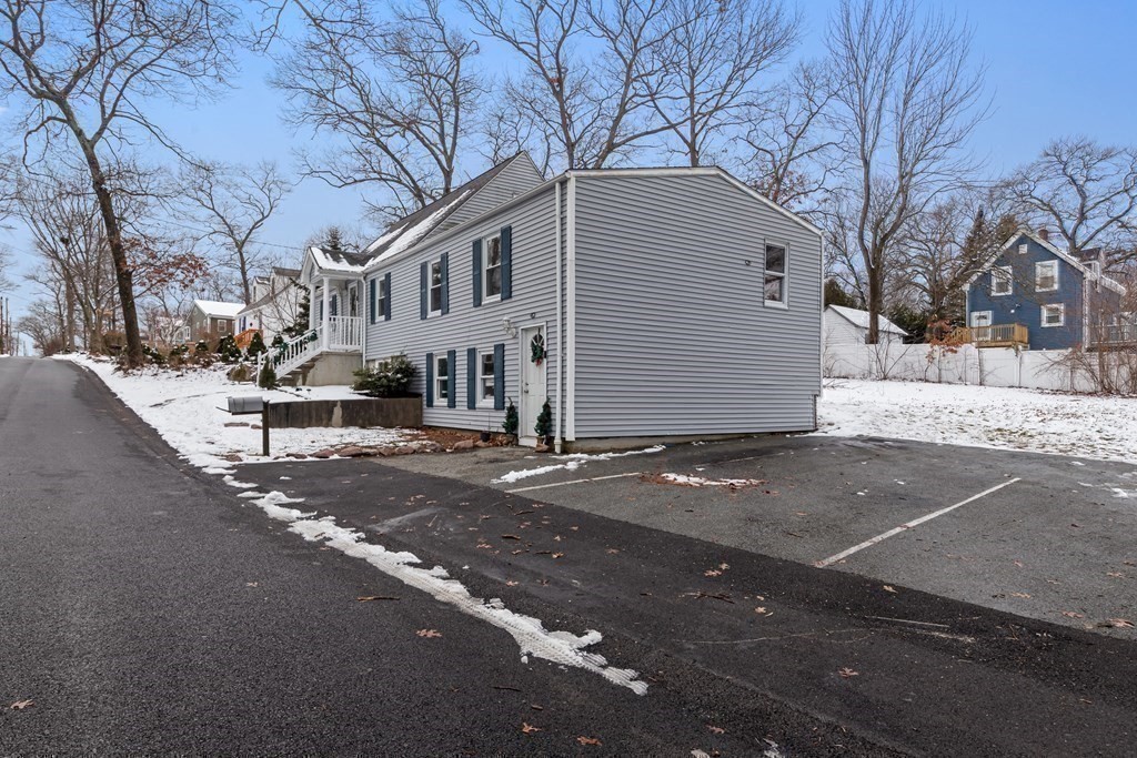 76 Rockefeller Street Randolph, MA 02368 - Photo 4 of 40 a front view of a house with a yard