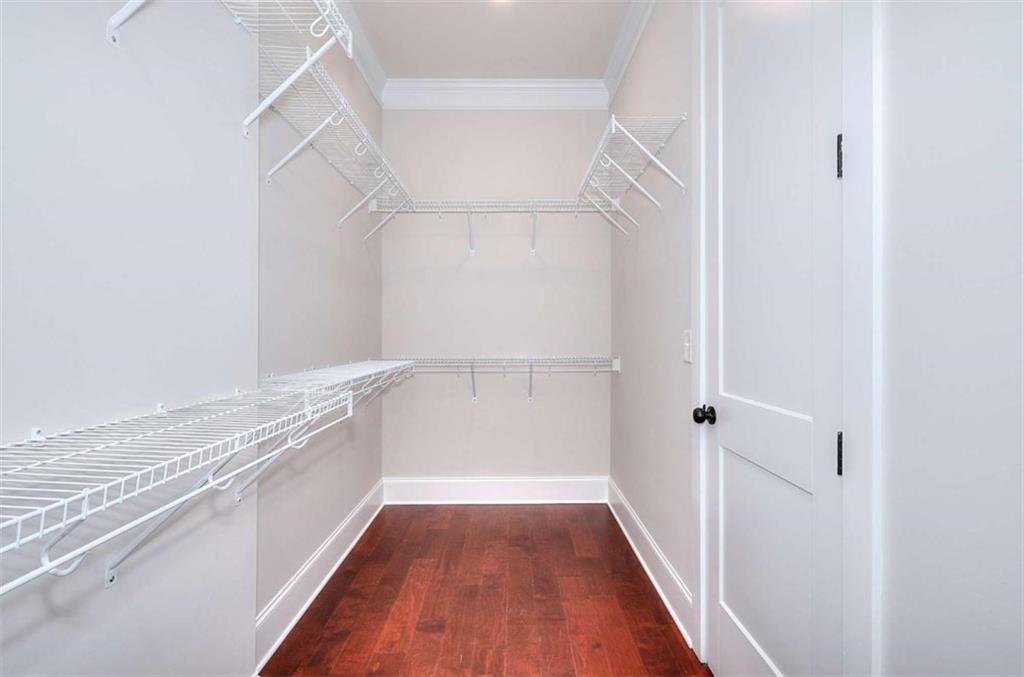2053 John Stowe Road Monroe, GA 30656 - Photo 24 of 66 a view of a walk in closet with wooden floor