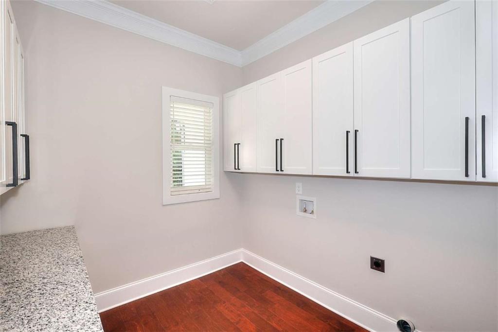 2053 John Stowe Road Monroe, GA 30656 - Photo 33 of 66 a view of an empty room with wooden floor and a window