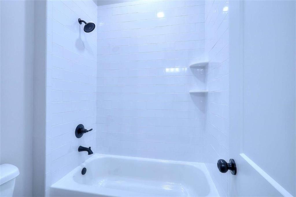 2053 John Stowe Road Monroe, GA 30656 - Photo 37 of 66 a bathroom with a bathtub