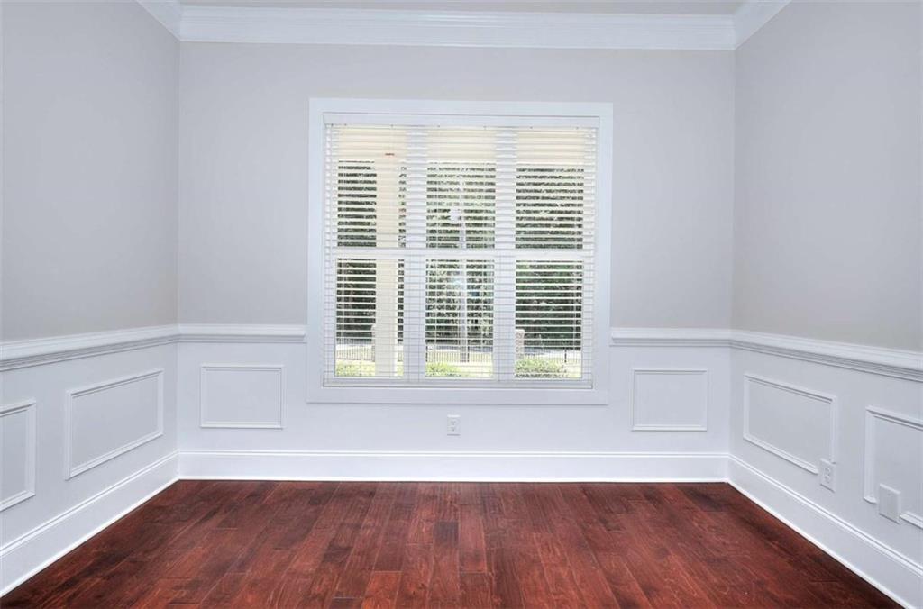 2053 John Stowe Road Monroe, GA 30656 - Photo 42 of 66 a view of a room with wooden floor and a window