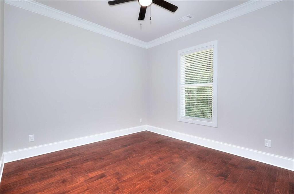 2053 John Stowe Road Monroe, GA 30656 - Photo 45 of 66 an empty room with a window and a ceiling fan