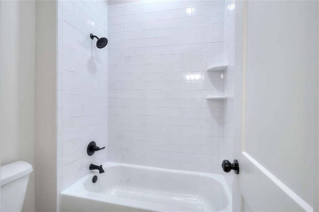 2053 John Stowe Road Monroe, GA 30656 - Photo 54 of 66 a bathroom with a bathtub