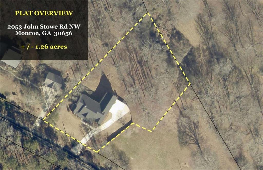 2053 John Stowe Road Monroe, GA 30656 - Photo 58 of 66 a sign that is sitting on a brick wall