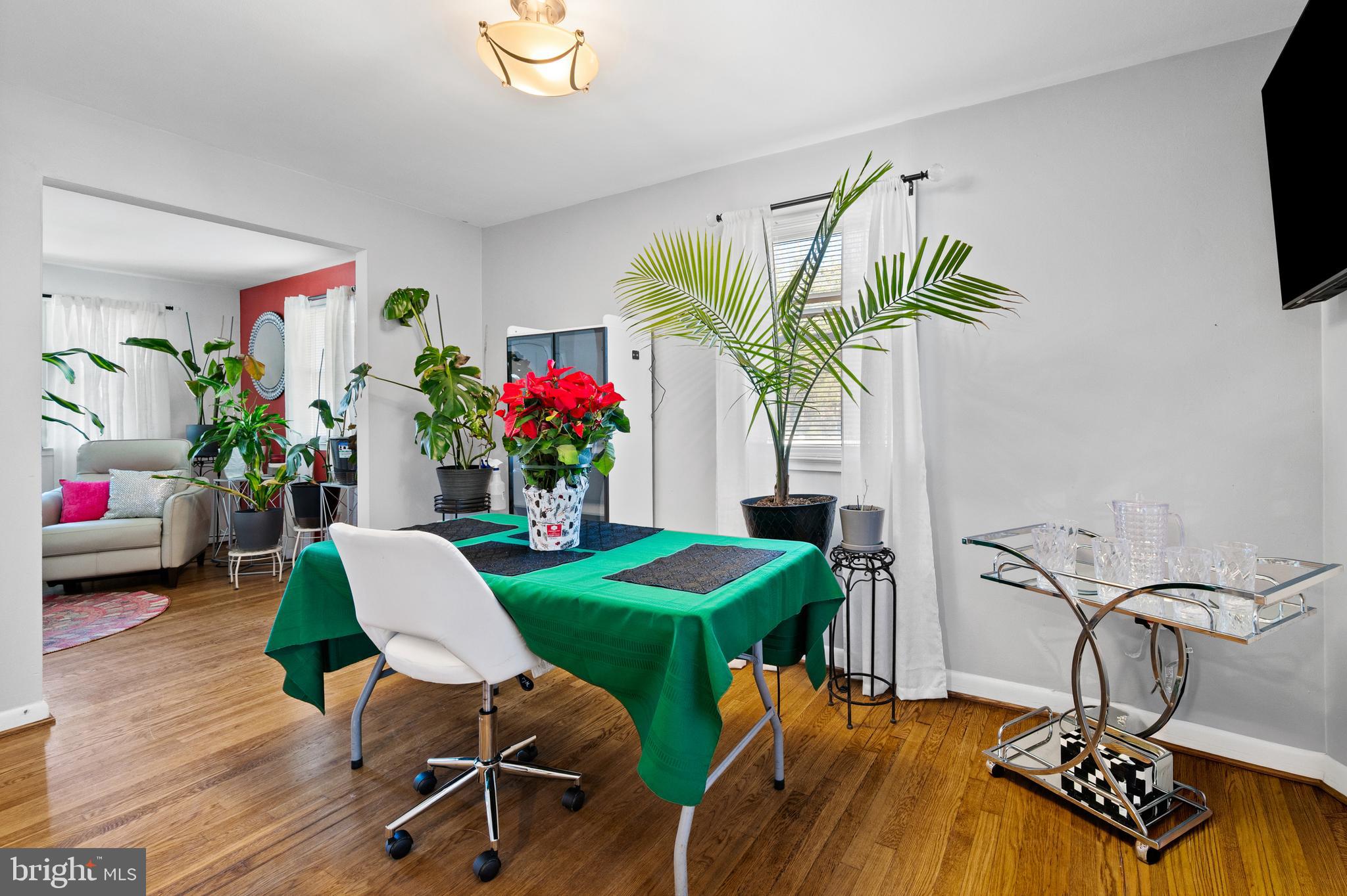 8900 Townsend Lane Clinton, MD 20735 - Photo 11 of 30 a view of a dining room with furniture and a potted plant