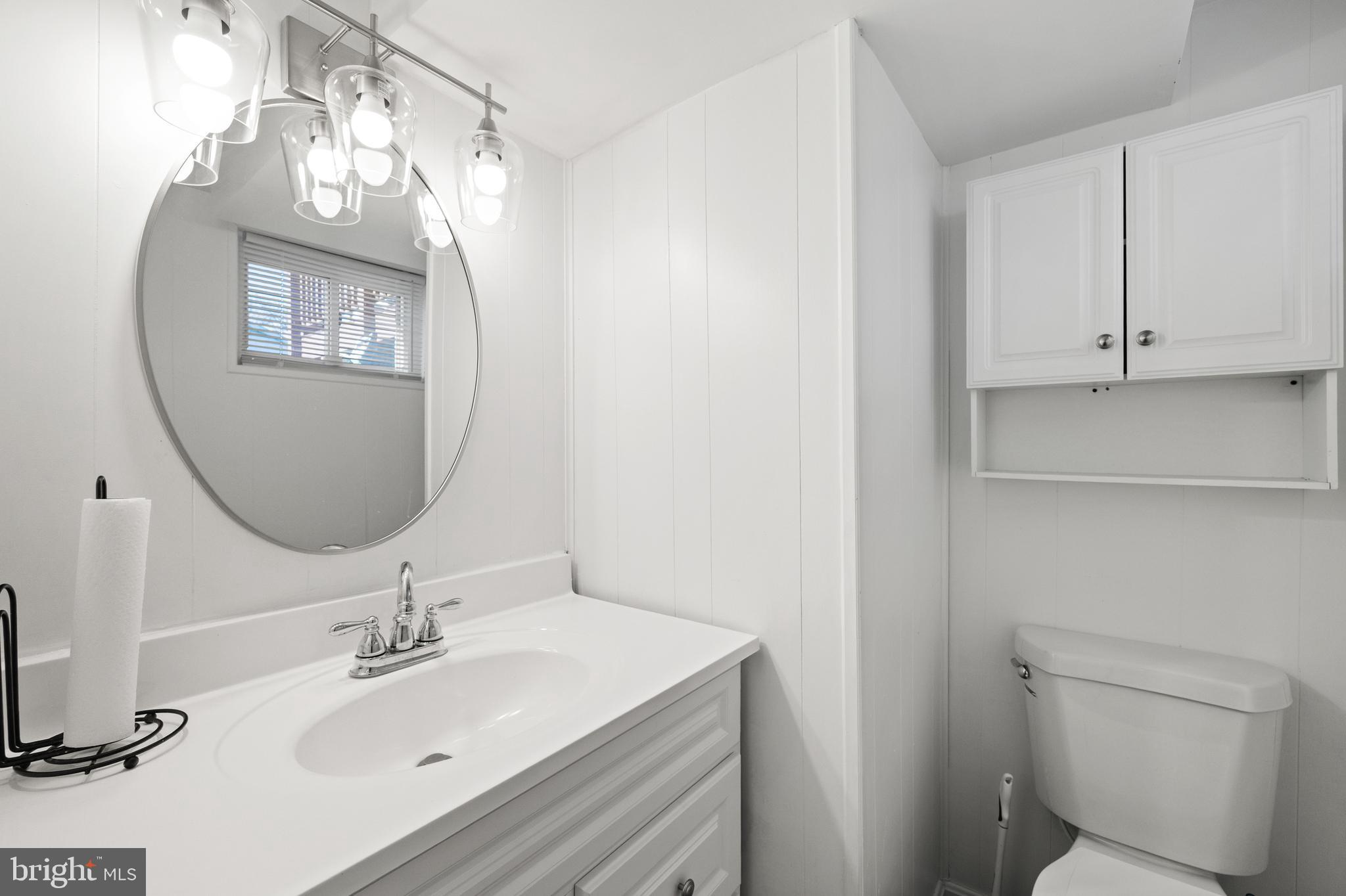 8900 Townsend Lane Clinton, MD 20735 - Photo 13 of 30 a bathroom with a sink vanity and a mirror
