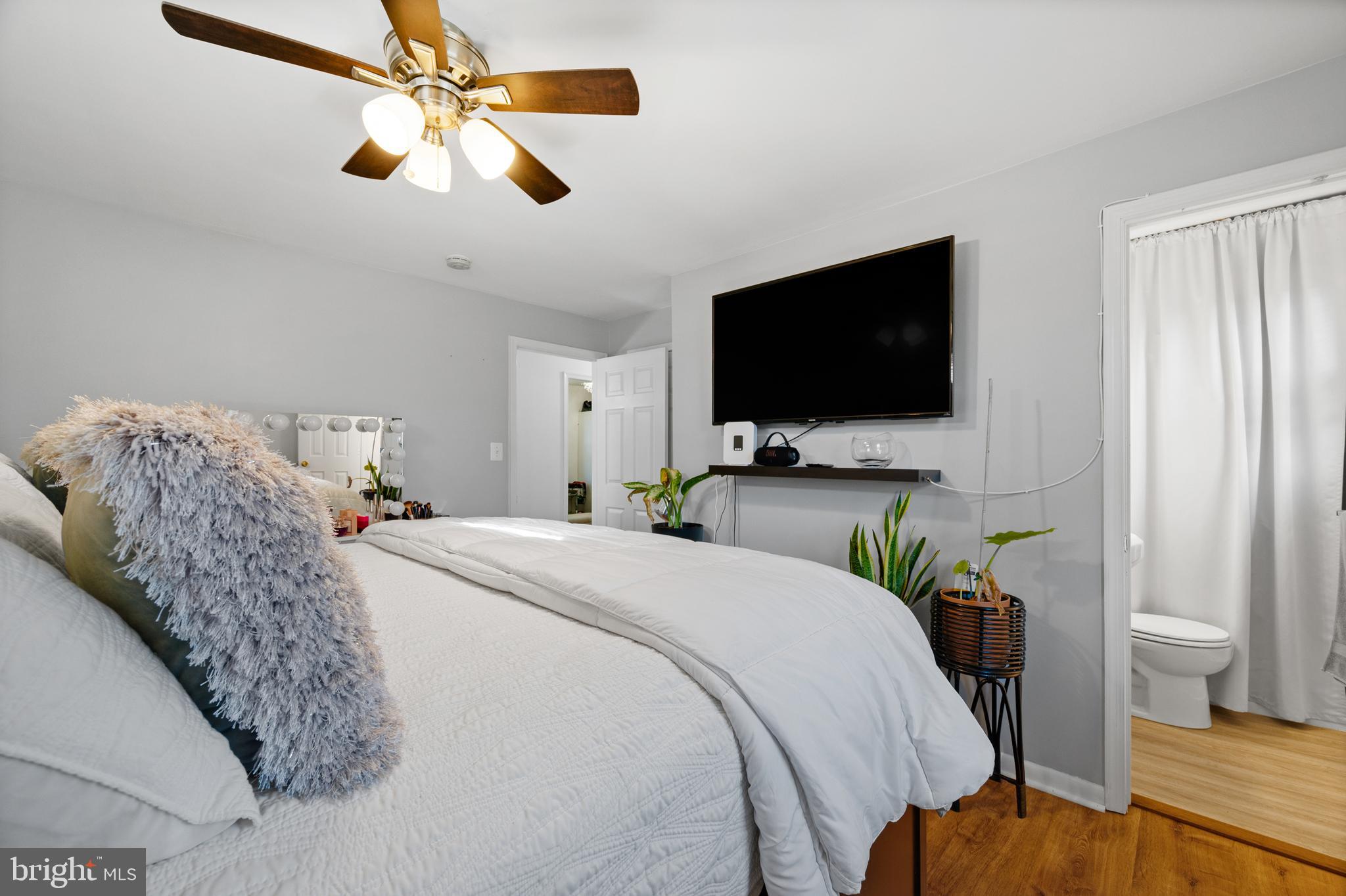 8900 Townsend Lane Clinton, MD 20735 - Photo 14 of 30 a bedroom with a bed and a flat screen tv