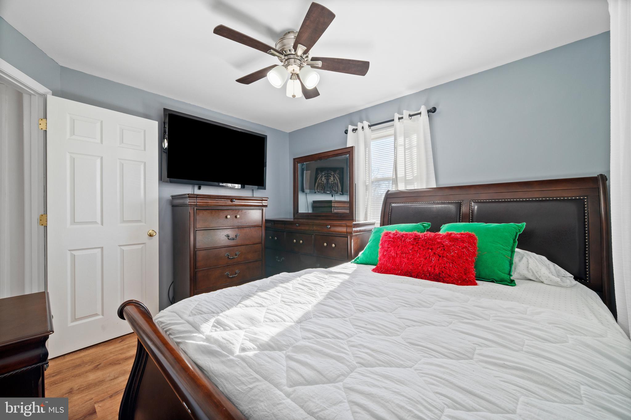 8900 Townsend Lane Clinton, MD 20735 - Photo 16 of 30 a bedroom with a bed and a flat screen tv
