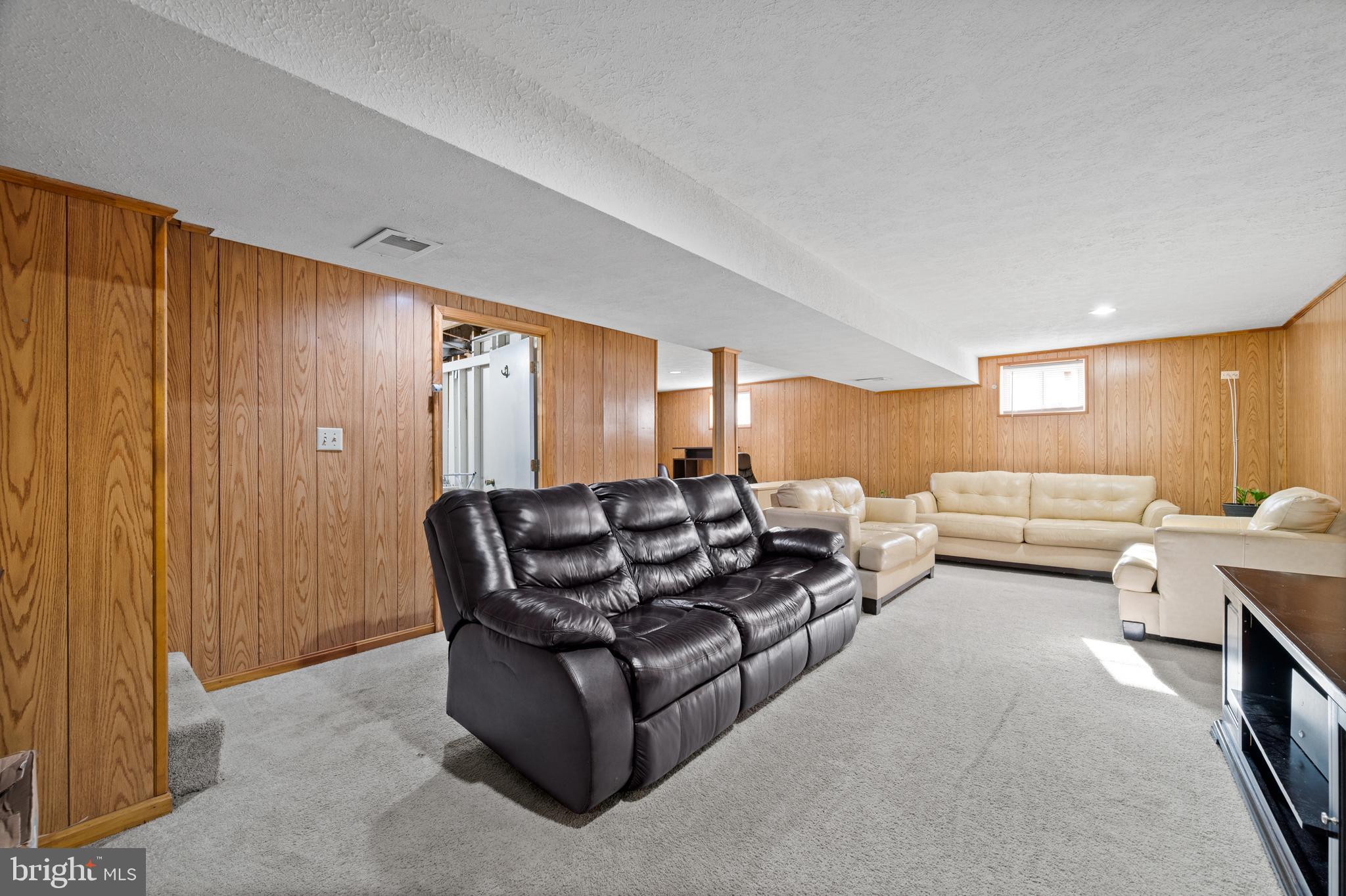 8900 Townsend Lane Clinton, MD 20735 - Photo 19 of 30 a living room with furniture and a window