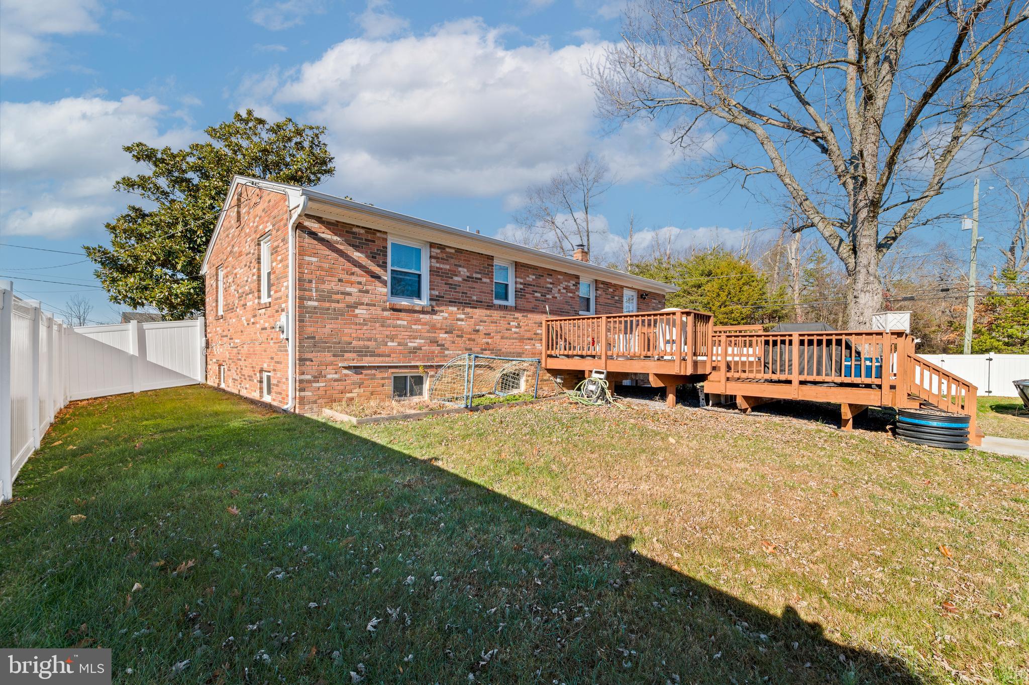 8900 Townsend Lane Clinton, MD 20735 - Photo 25 of 30 a front view of a house with a yard and garage