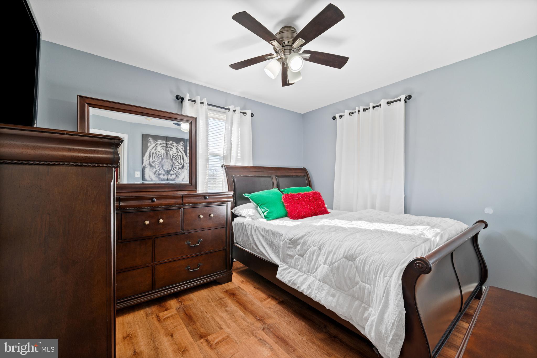8900 Townsend Lane Clinton, MD 20735 - Photo 5 of 30 a bedroom with a bed and a tv on the dresser