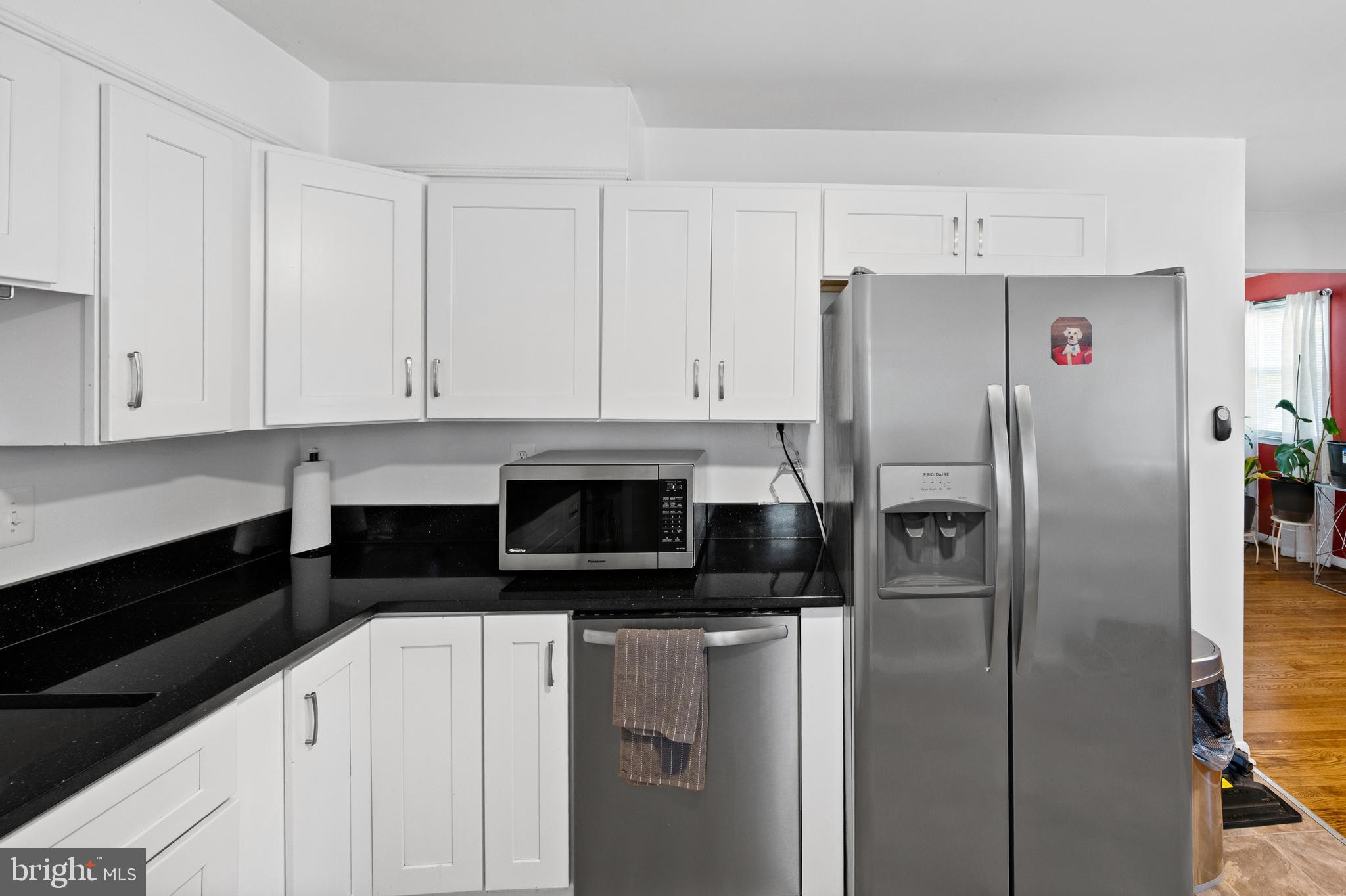 8900 Townsend Lane Clinton, MD 20735 - Photo 10 of 30 a kitchen with stainless steel appliances a refrigerator and cabinets