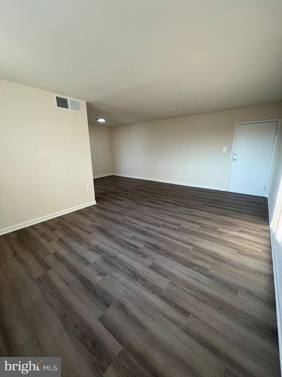 2500 Queens Chapel Road Hyattsville, MD 20782 - Photo 5 of 6 an empty room with wooden floor
