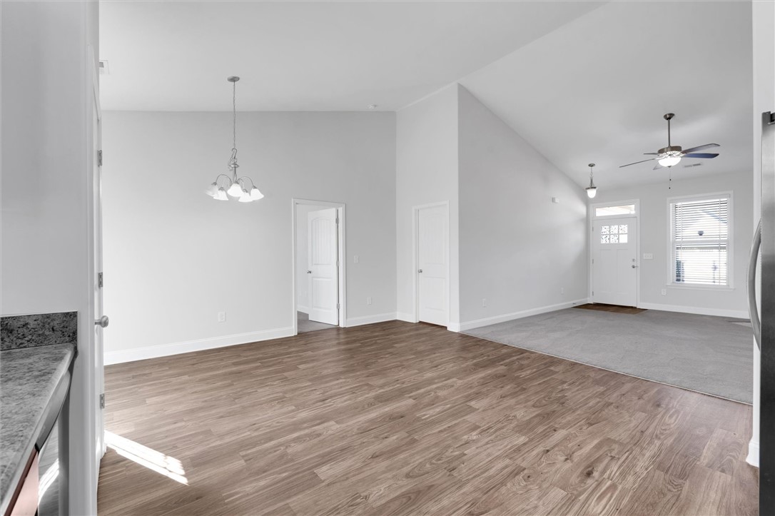 155 Norfolk Circle Anderson, SC 29625 - Photo 9 of 33 This bright and airy interior features a vaulted ceiling, providing an expansive feel to the open living space.