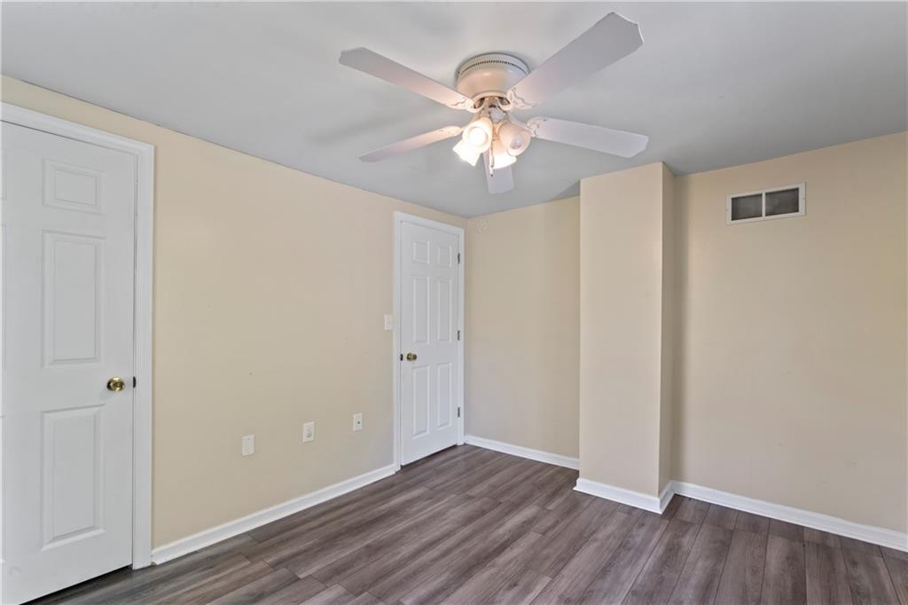 1217 25th Street Beaver Falls, PA 15010 - Photo 23 of 32 a view of an empty room with wooden floor