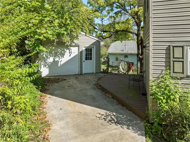 a view of a house with a tree