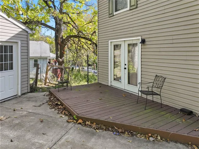 a view of a dinning table and chairs in a patio