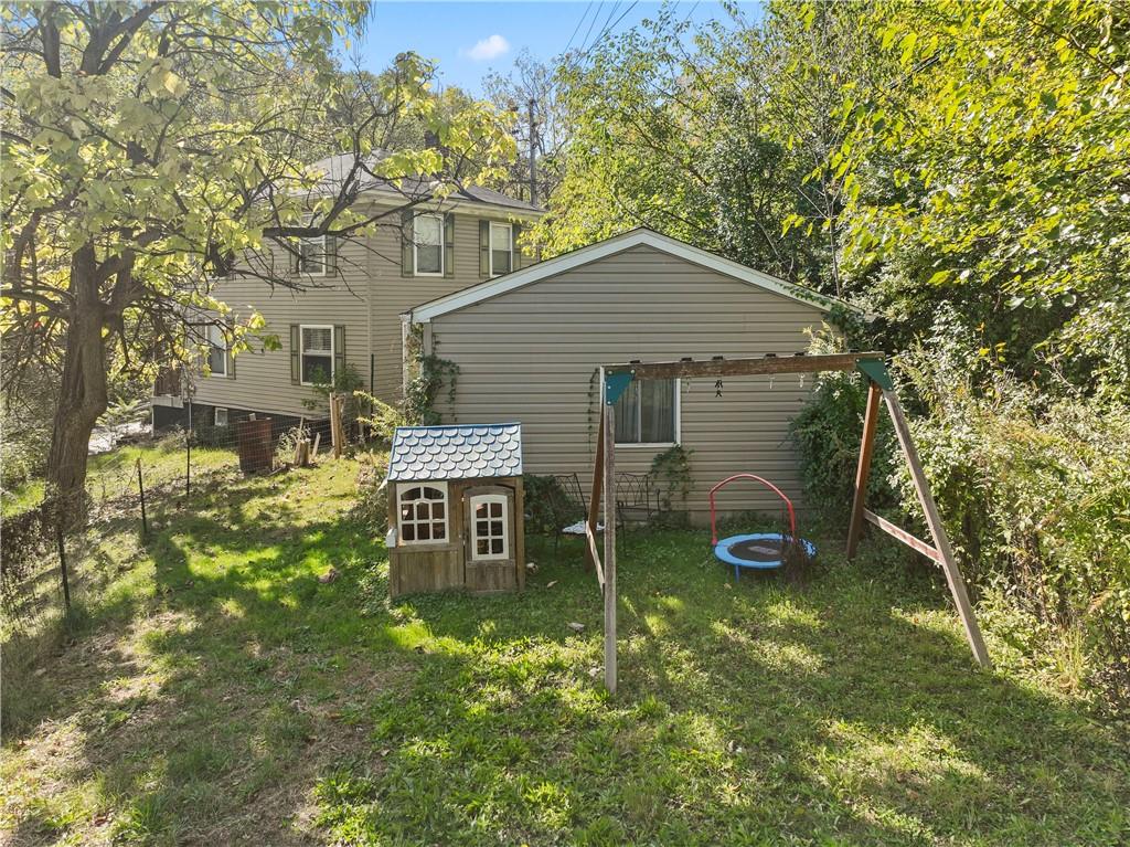 1217 25th Street Beaver Falls, PA 15010 - Photo 10 of 32 a backyard of a house with table and chairs