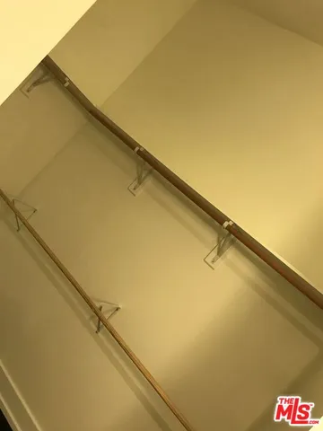 view of a room with bed and wooden floor