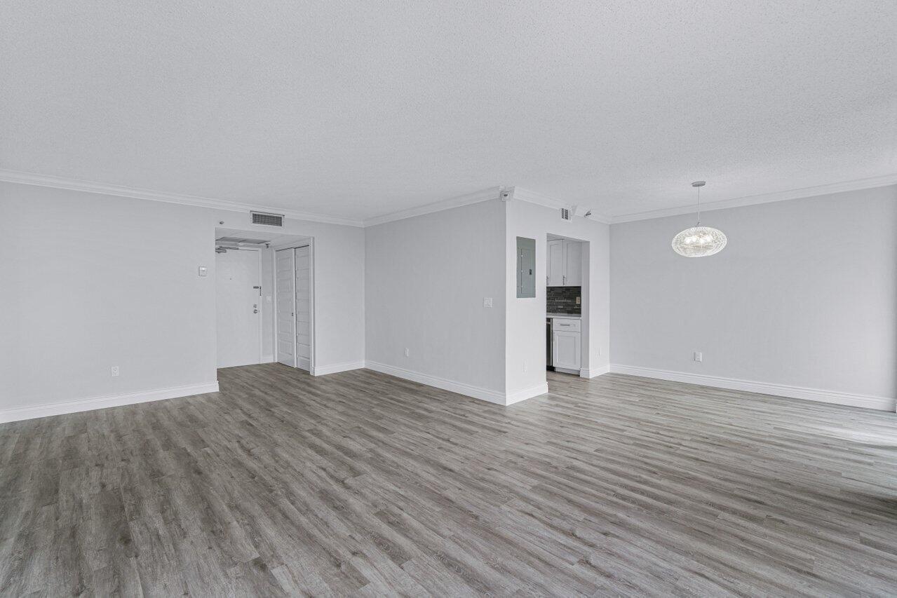 859 Jeffery Street, Unit 609 Boca Raton, FL 33487 - Photo 16 of 34 living room to kitchen