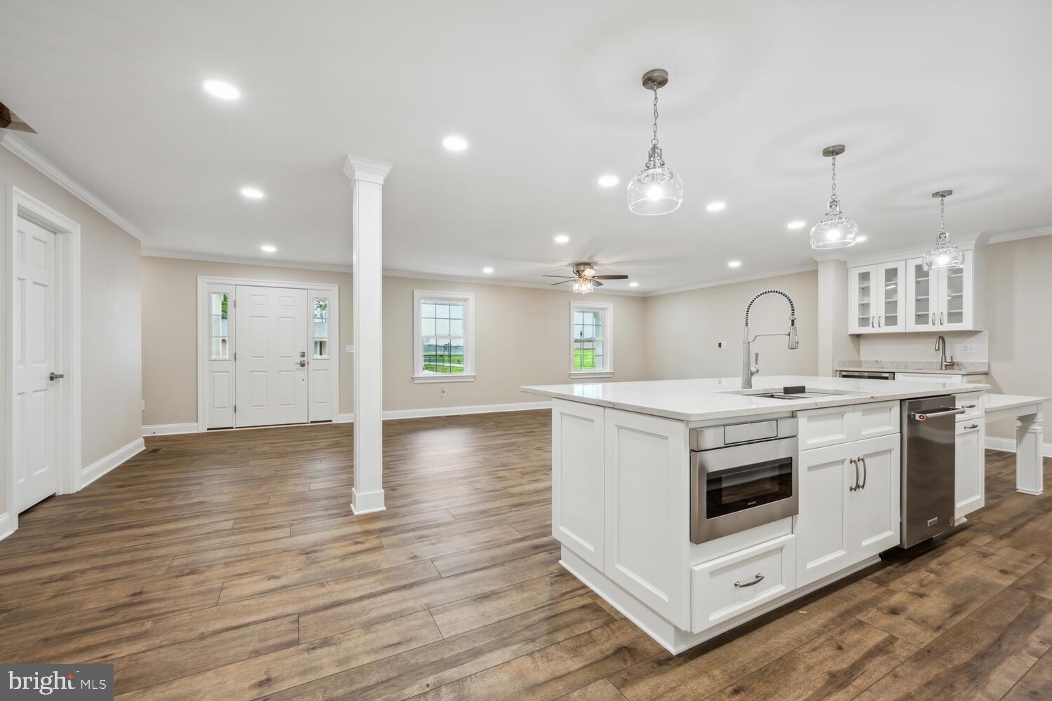 405 Collins Avenue Hurlock, MD 21643 - Photo 11 of 49 a kitchen with a stove and a sink