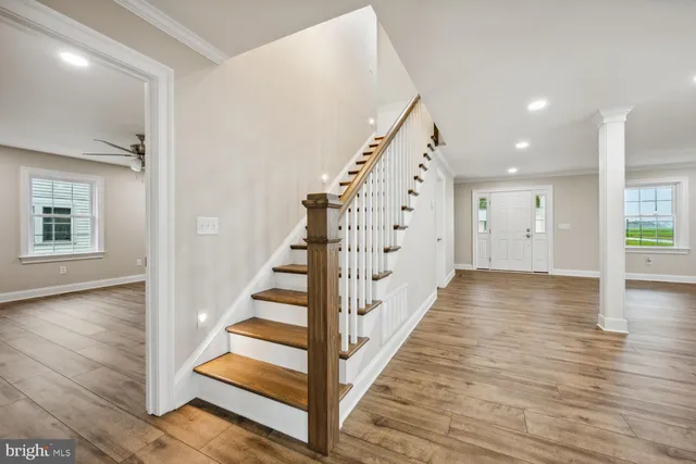 a view of entryway with wooden floor