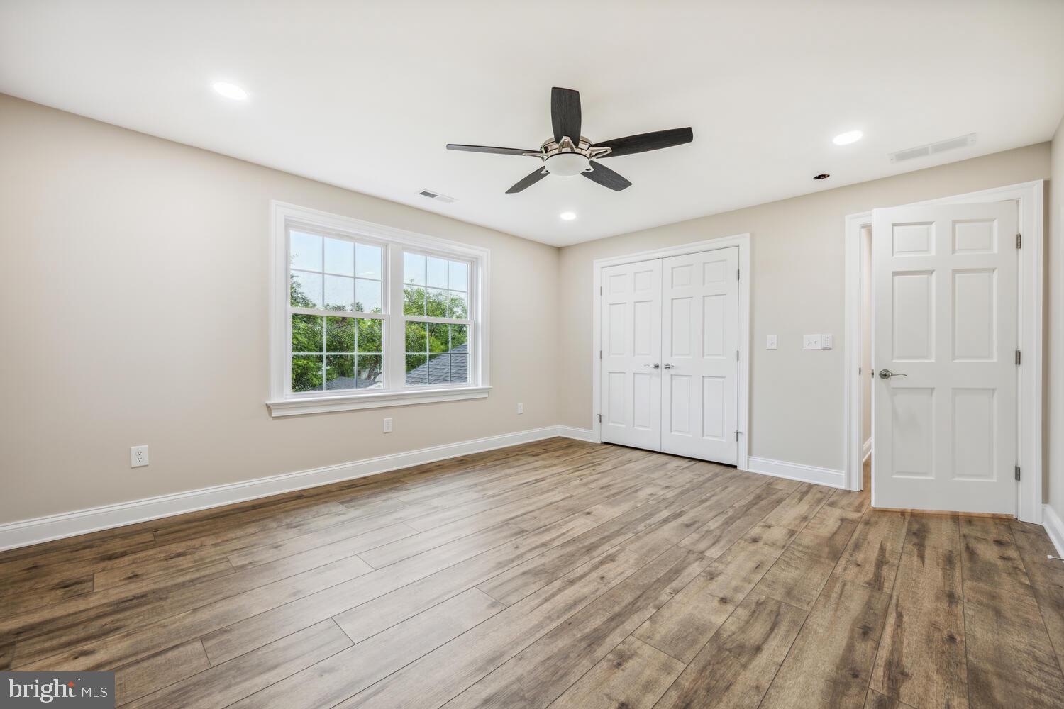 405 Collins Avenue Hurlock, MD 21643 - Photo 29 of 49 wooden floor in an empty room with a window