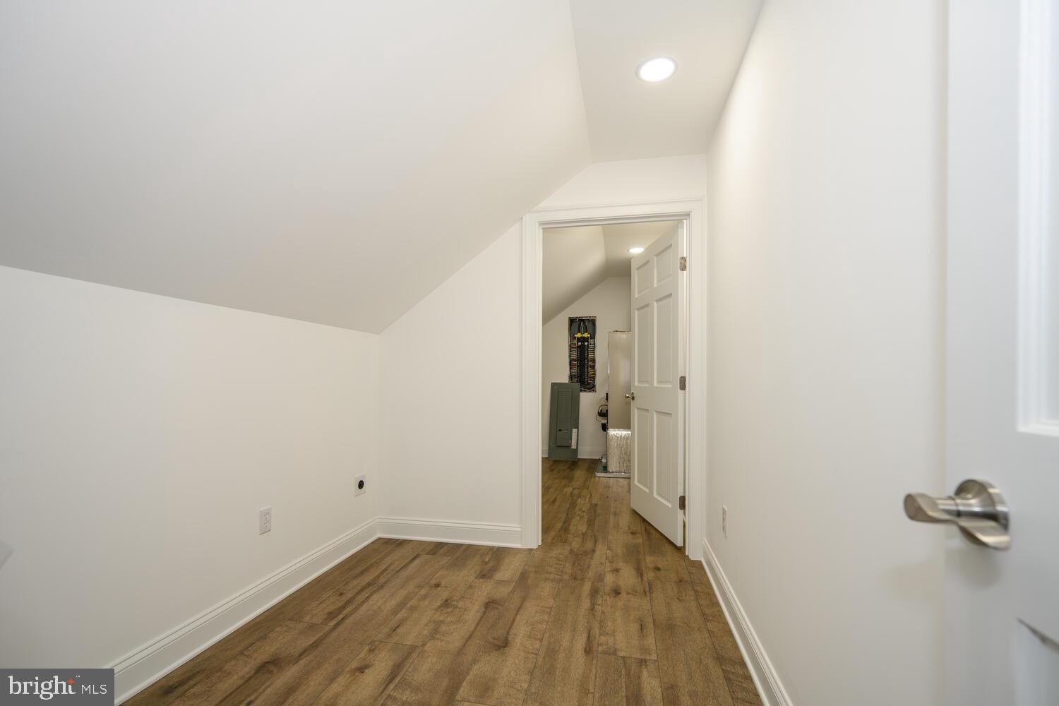 405 Collins Avenue Hurlock, MD 21643 - Photo 31 of 49 a view of a room with wooden floor and a bathroom
