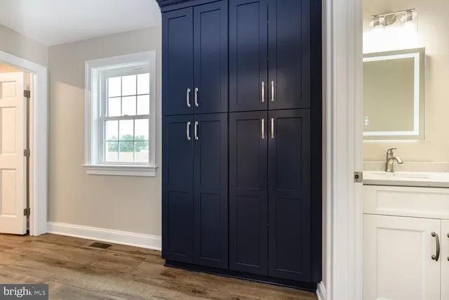 a bathroom with a sink and mirror