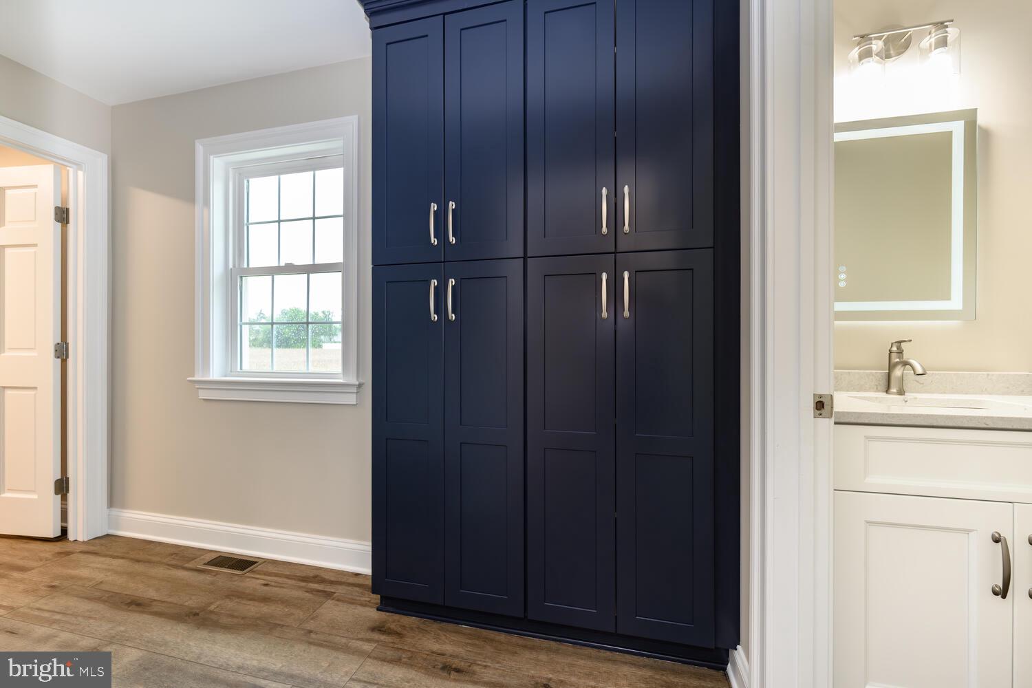 405 Collins Avenue Hurlock, MD 21643 - Photo 32 of 49 a bathroom with a sink and mirror
