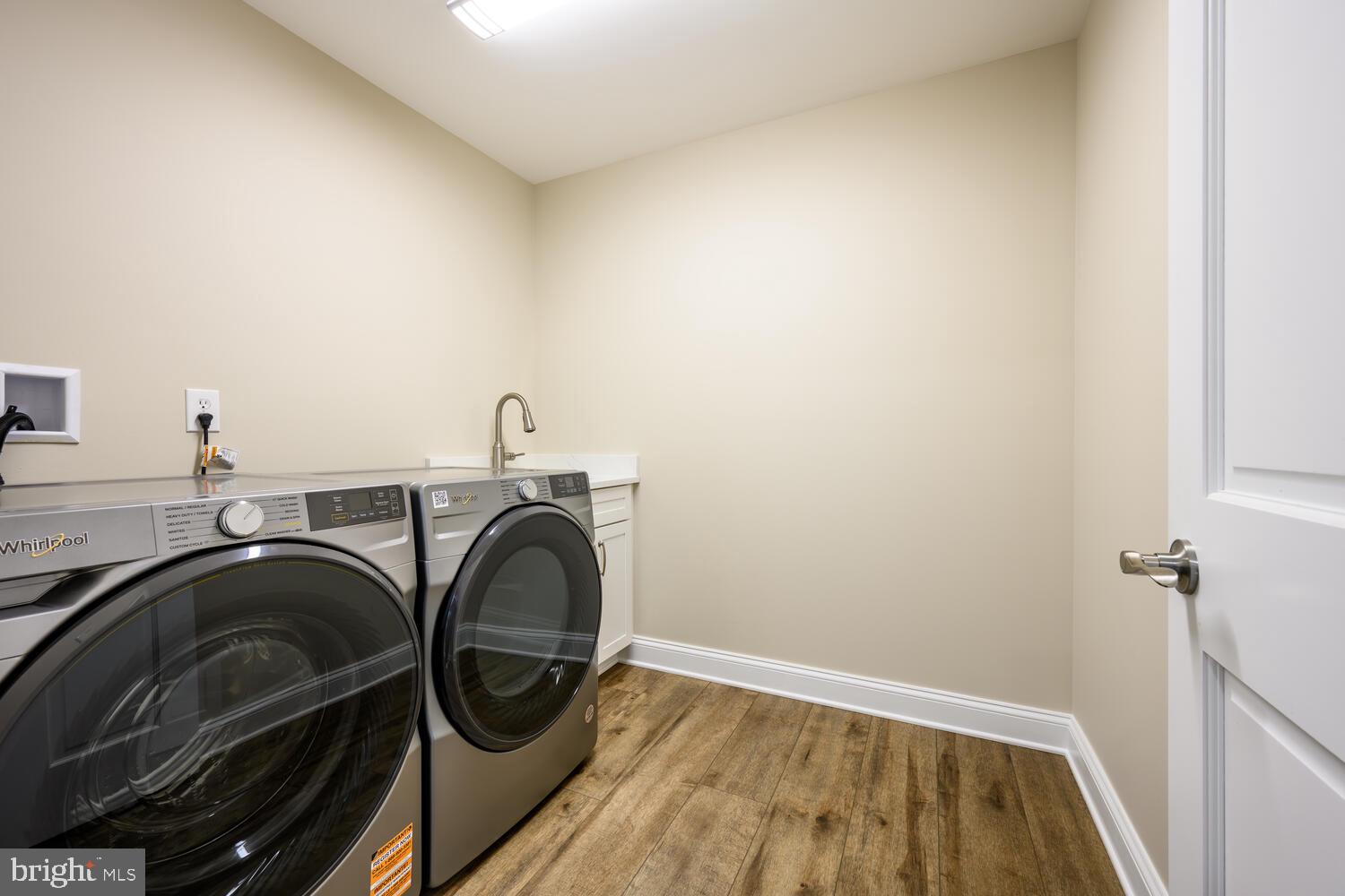 405 Collins Avenue Hurlock, MD 21643 - Photo 35 of 49 a utility room with sink dryer and washer