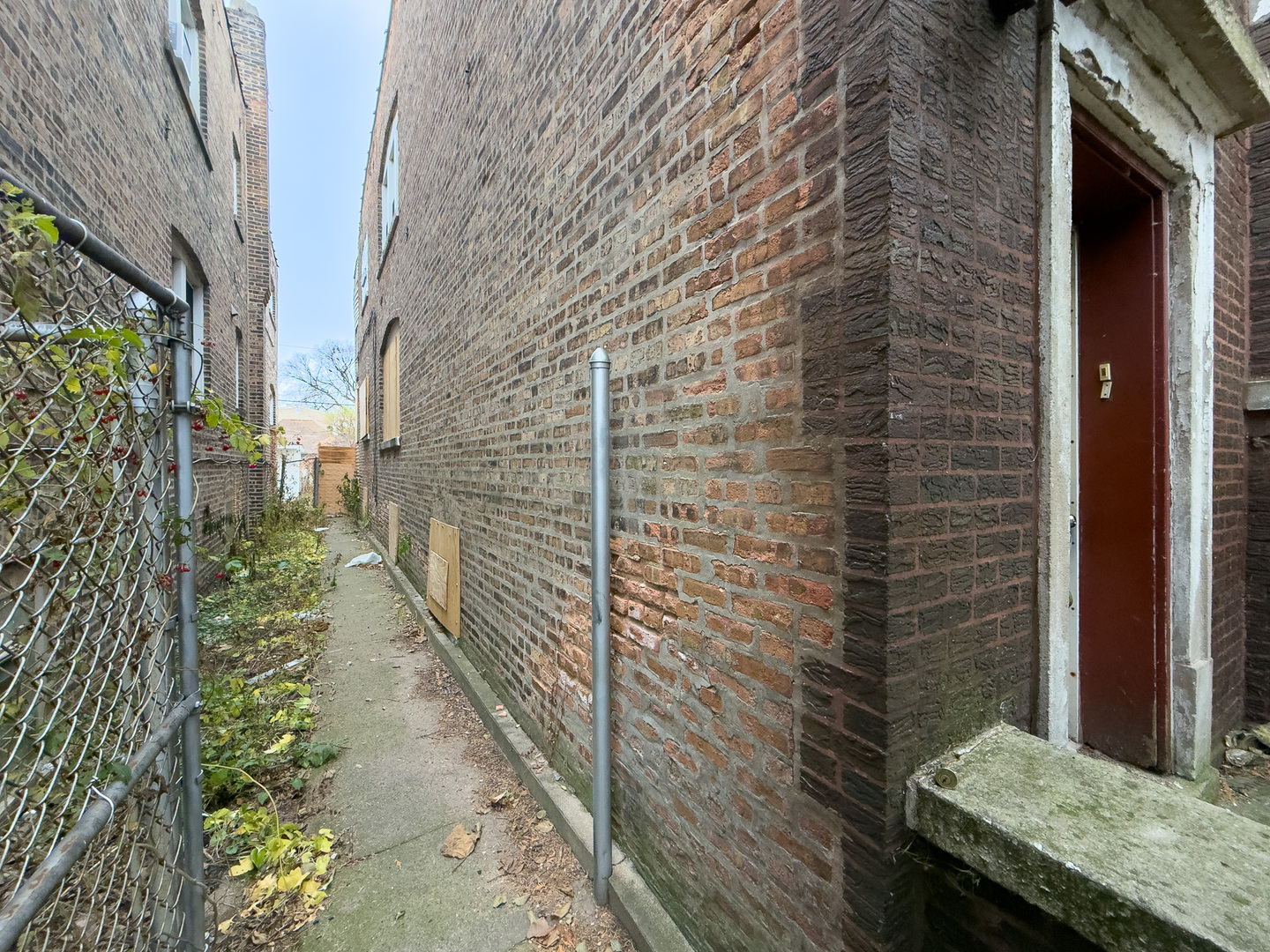 609 East 88th Place Chicago, IL 60619 - Photo 25 of 27 a pathway of a house with a yard