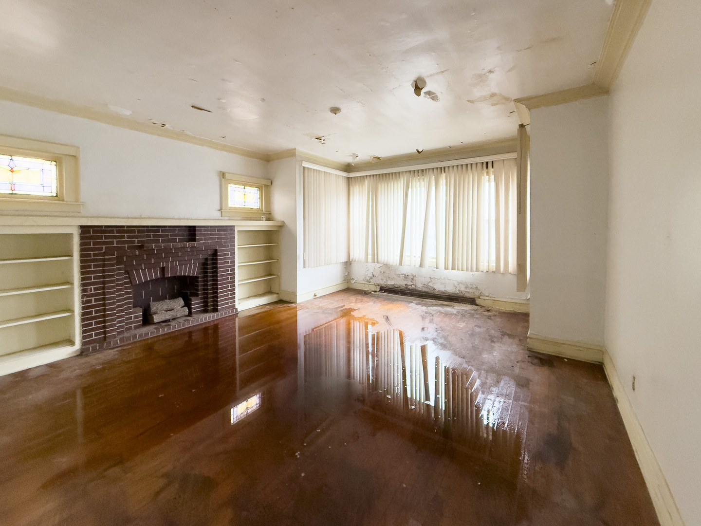 609 East 88th Place Chicago, IL 60619 - Photo 9 of 27 a view of an empty room with wooden floor and a window